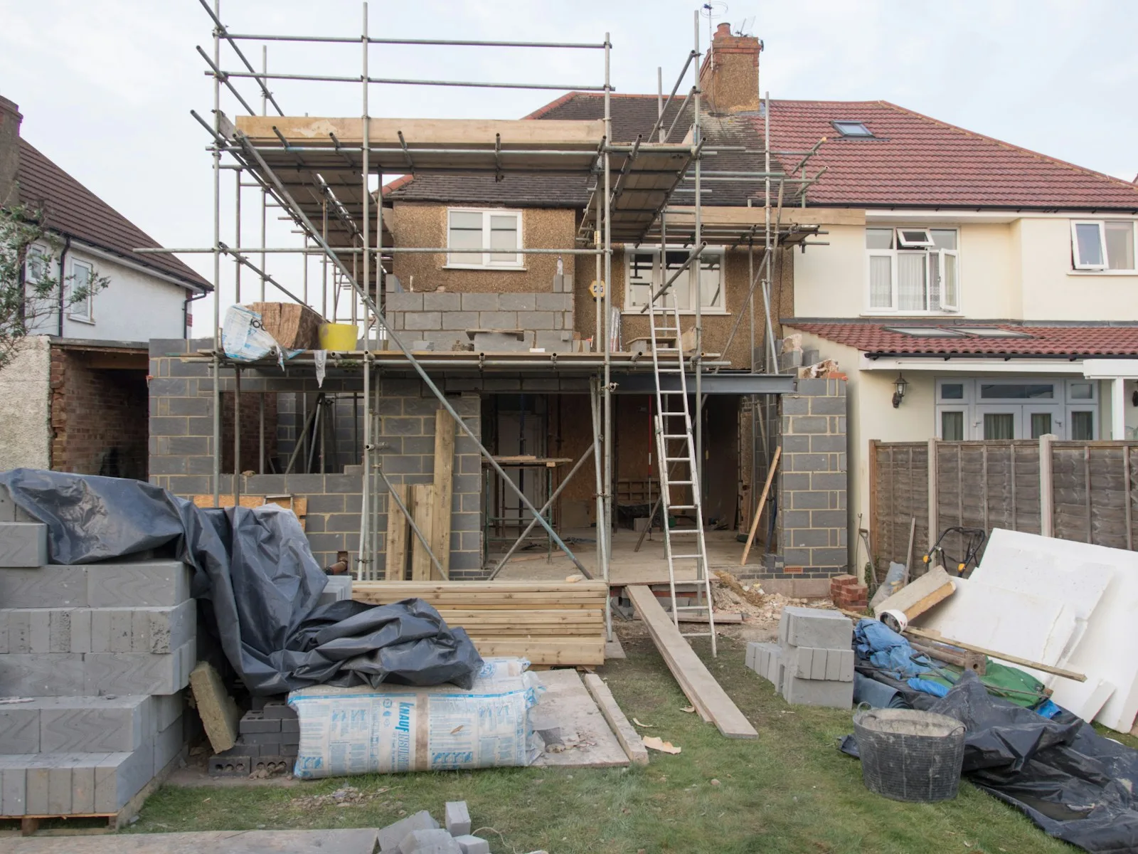 Residential renovation project with exterior framing and scaffolding