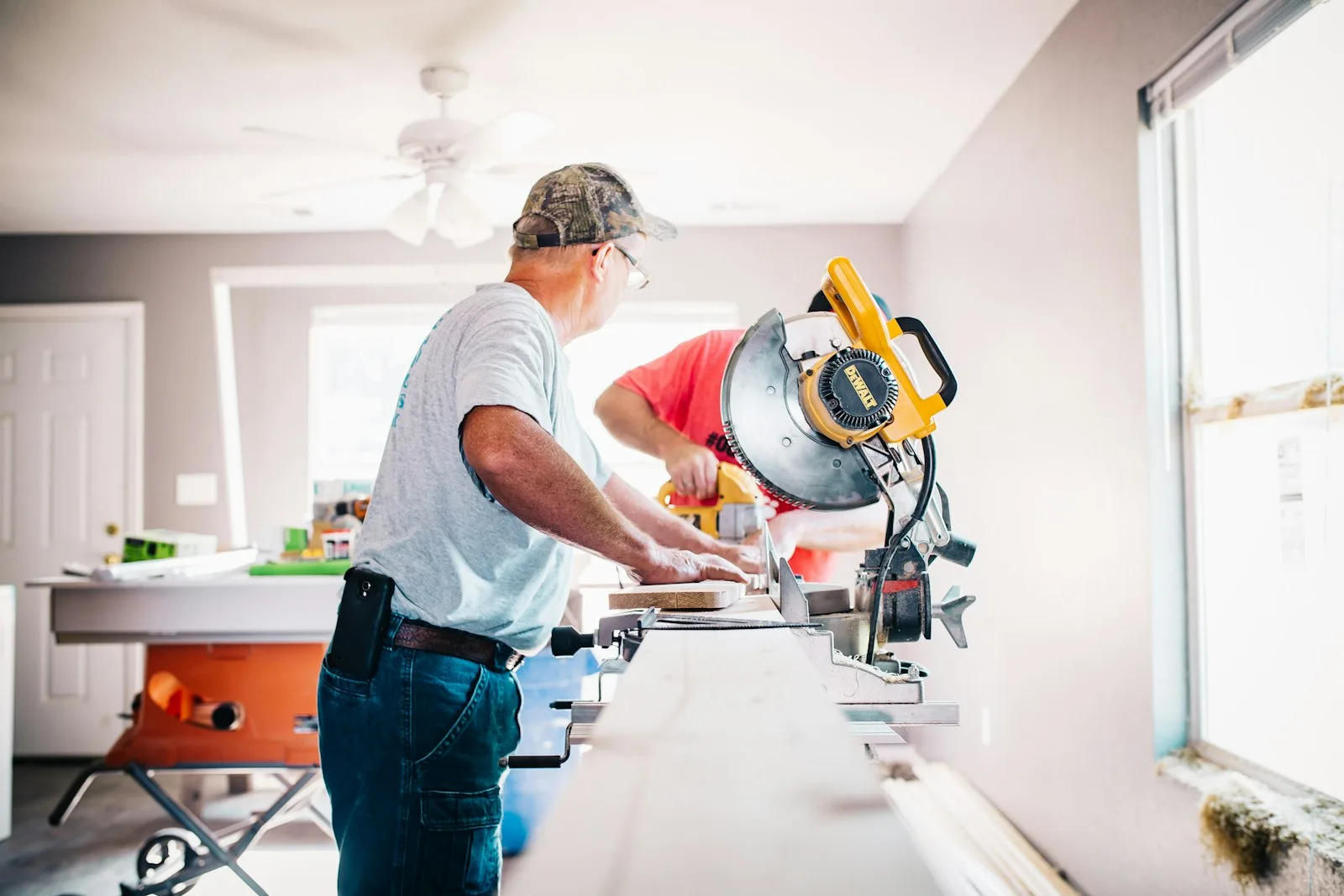 Renovation professionals completing precision carpentry inside a home